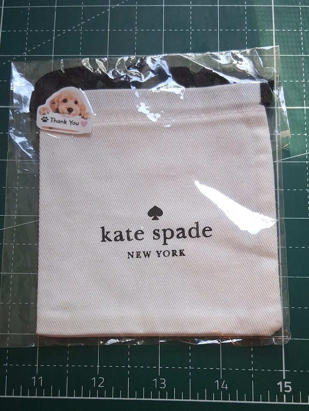 kate spade Cream Drawstring Pouch with Black Accents